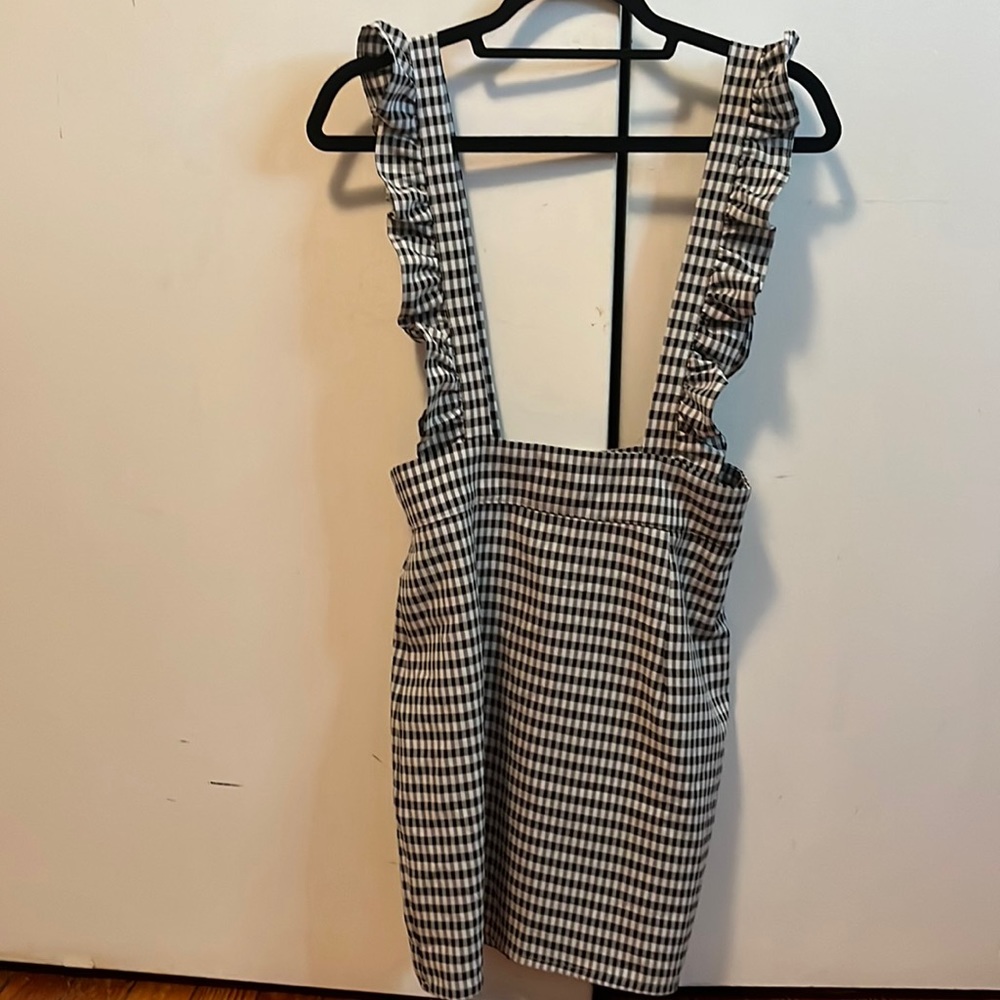 Checkered skirt with overall straps